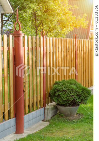 brick and mettal fence 61233556