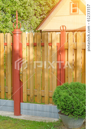 brick and mettal fence 61233557
