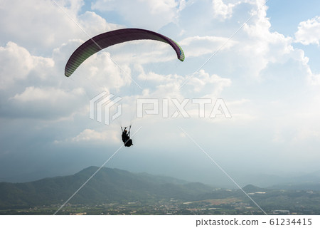 colorful paragliding over blue sky at town colorful paragliding over blue sky at town 61234415
