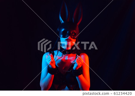 sexy young submissive girl in Bunny mask in leather handcuffs sexy young submissive girl in Bunny mask in leather handcuffs 61234420