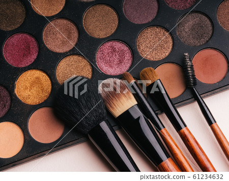 makeup brush set and professional eye shadow palette 61234632
