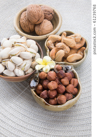 nuts or hazelnuts nuts and mix nut on a background nuts or hazelnuts nuts and mix nut on a background 61239768