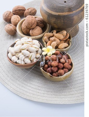 nuts or hazelnuts nuts and mix nut on a background nuts or hazelnuts nuts and mix nut on a background 61239769