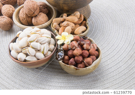 nuts or hazelnuts nuts and mix nut on a background nuts or hazelnuts nuts and mix nut on a background 61239770