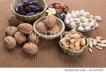 nuts or hazelnuts nuts and mix nut on a background nuts or hazelnuts nuts and mix nut on a background 61239785