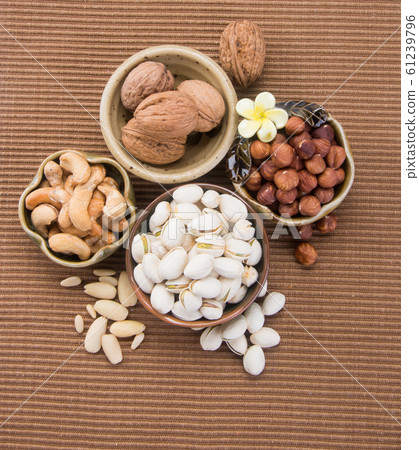 nuts or hazelnuts nuts and mix nut on a background nuts or hazelnuts nuts and mix nut on a background 61239796