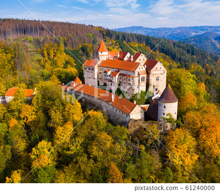 Medieval castle of Pernstein on a hill in the forest. South Moravian region. Czech Republic Medieval castle of Pernstein on a hill in the forest. South Moravian region. Czech Republic 61240000