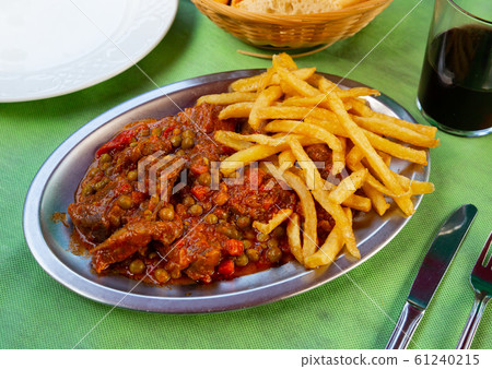 Asturian stewed beef with potatoes Asturian stewed beef with potatoes 61240215