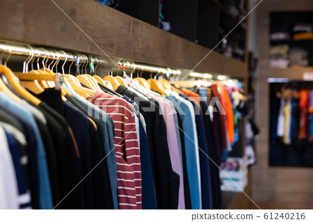 Assortment of summer clothing in modern store 61240216