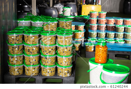 Stacked plastic buckets with pickled olives Stacked plastic buckets with pickled olives 61240244