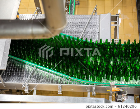 Bottles on bottling line at brewery Bottles on bottling line at brewery 61240296