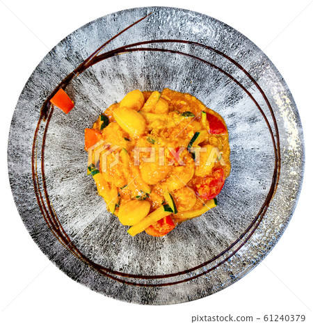 Top view of Italian gnocchi with zucchini and salmon Top view of Italian gnocchi with zucchini and salmon 61240379
