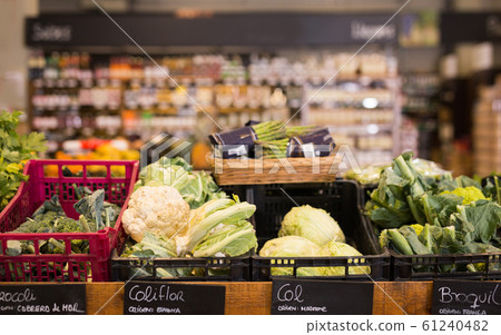 Fresh cabbage and broccoli on the counter in the store Fresh cabbage and broccoli on the counter in the store 61240482