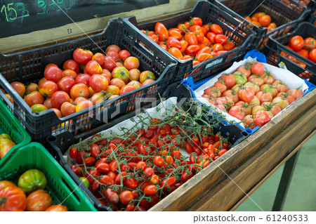 Boxes with tomatoes in grocery store Boxes with tomatoes in grocery store 61240533