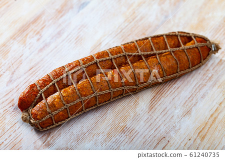 Roasted chezh sausages on cutting board Roasted chezh sausages on cutting board 61240735