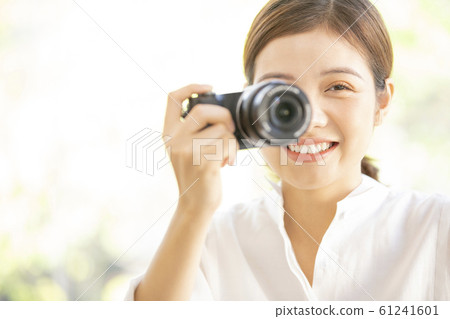 A woman with a camera 61241601