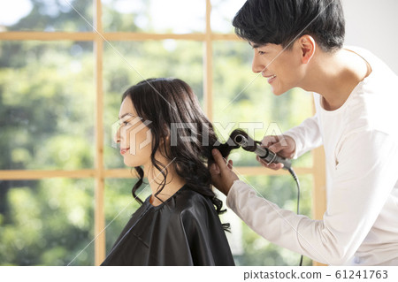 Male hairdresser and female customer 61241763
