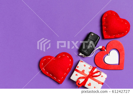 Top view of gift box, car key, wooden and textile 61242727