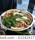 Grilled beef giblets served with ingredients like leek and onion 61242917