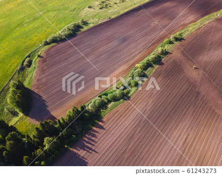 Drone view on a plowed field 61243273