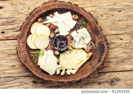 Cheese platter on wooden tray Cheese platter on wooden tray 61243595