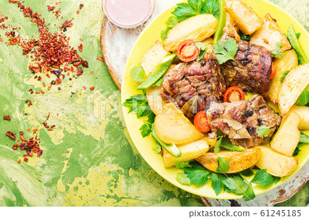 Grilled meat and potatoes 61245185