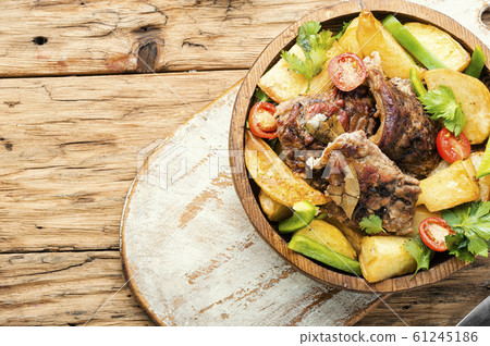 Baked meat with potatoes 61245186