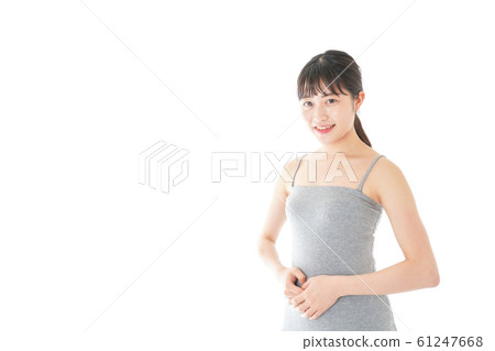 Young woman wearing a tufted top 61247668