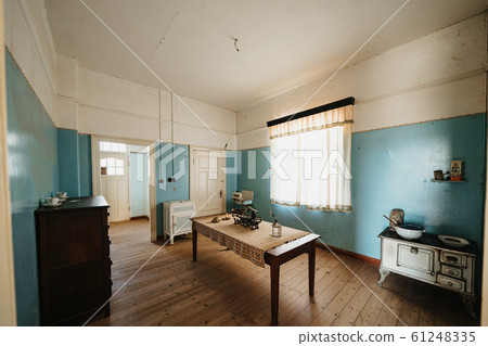 Interior of a colonial living room with table and furnitures Interior of a colonial living room with table and furnitures 61248335
