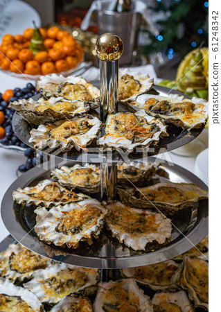 Fresh open oyster on a white plate. in the restaurant appetizer Fresh open oyster on a white plate. in the restaurant appetizer 61248342