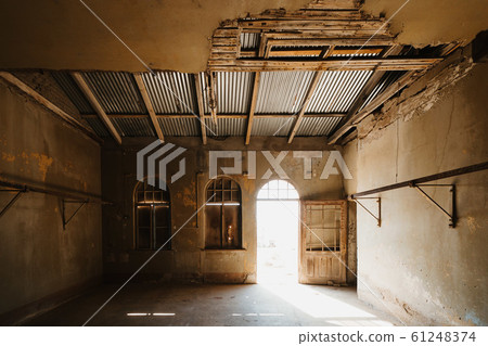abandoned old room in ruined partially collapsed building 61248374