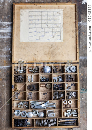 Wooden box with an assortment of hardware 61248533