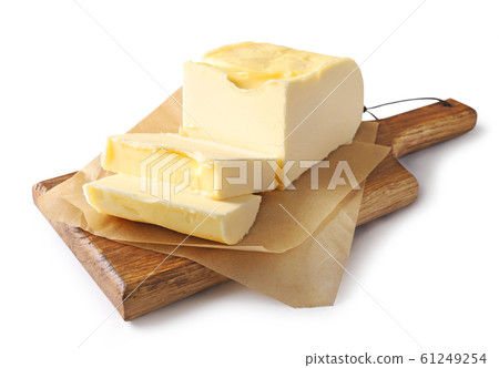 pieces of butter on wooden cutting board pieces of butter on wooden cutting board 61249254