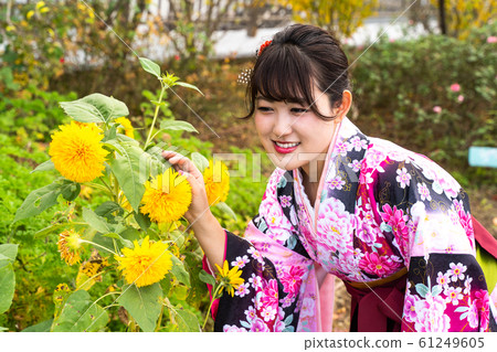A woman with a small kimono and a hakama A woman with a small kimono and a hakama 61249605