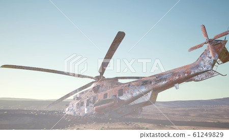 old rusted military helicopter in the desert at 61249829