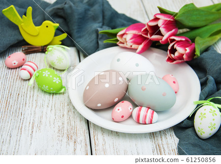 Easter eggs and tulips 61250856