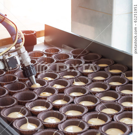 Making chocolate muffins in the confectionery industry. Delicious pastry for dessert, copy space, food, bakery products 61251951