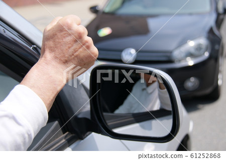 An old man who is sharp in a reverse car 61252868
