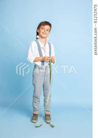 Little boy dreaming about future profession of seamstress Little boy dreaming about future profession of seamstress 61252978