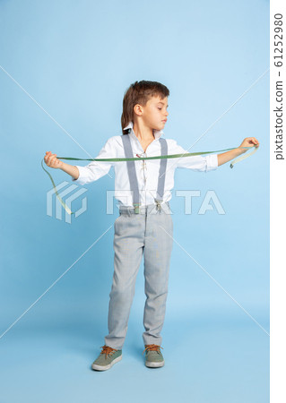 Little boy dreaming about future profession of seamstress Little boy dreaming about future profession of seamstress 61252980