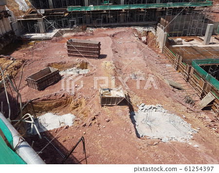 Pile cap and column stump under construction at the construction site. Constructed using reinforced concrete with plywood timber as a form work. Pile cap and column stump under construction at the construction site. Constructed using reinforced concrete with plywood timber as a form work. 61254397