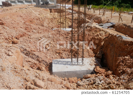 Casted pile cap at the construction site. It is part of the building foundation system. Protruded rebar is for the next stage of work. Casted pile cap at the construction site. It is part of the building foundation system. Protruded rebar is for the next stage of work. 61254705