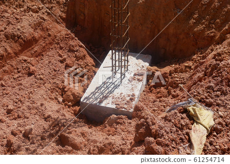 Casted pile cap at the construction site. It is part of the building foundation system. Protruded rebar is for the next stage of work. Casted pile cap at the construction site. It is part of the building foundation system. Protruded rebar is for the next stage of work. 61254714