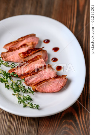 Slices of duck breast Slices of duck breast 61255202