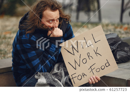 Homeless man in a durty clothes autumn city Homeless man in a durty clothes autumn city 61257723
