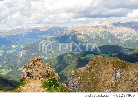 Amazing panoramic view from Seceda park on Dolomites Alps, Odle - Geisler mountain group, Secede peak and Seiser Alm (Alpe Siusi). Selva di val gardena, Trentino Alto Adige, South Tyrol, Italy, Europe Amazing panoramic view from Seceda park on Dolomites Alps, Odle - Geisler mountain group, Secede peak and Seiser Alm (Alpe Siusi). Selva di val gardena, Trentino Alto Adige, South Tyrol, Italy, Europe 61257969