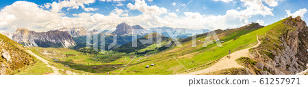 Amazing panoramic view from Seceda park on Dolomites Alps, Odle - Geisler mountain group, Secede peak and Seiser Alm (Alpe Siusi). Selva di val gardena, Trentino Alto Adige, South Tyrol, Italy, Europe 61257971