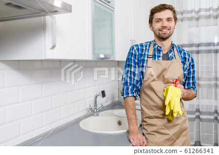 Young Handsome Man Posing as the Housework is Finished 61266341