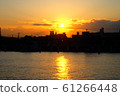 Riverside at sunset 61266448