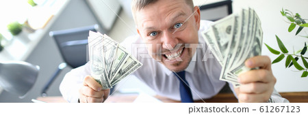 Handsome smiling adult caucasian businessman hold Handsome smiling adult caucasian businessman hold 61267123